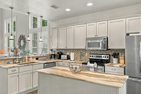 Kitchen with microwave, range and coffee makers