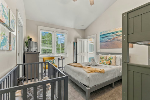 Bunk room with queen bed and crib