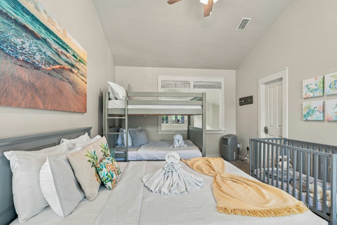 Bunk room with queen bed and full-over-full bunk bed