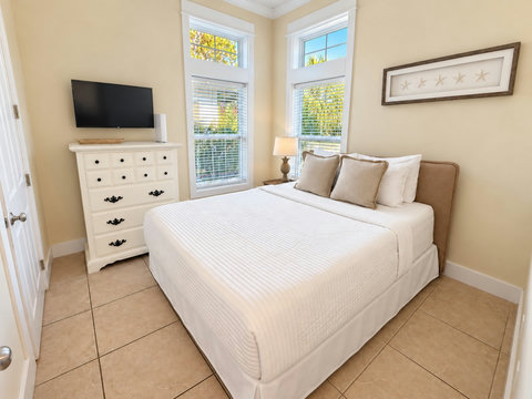Ground-floor queen bedroom with TV