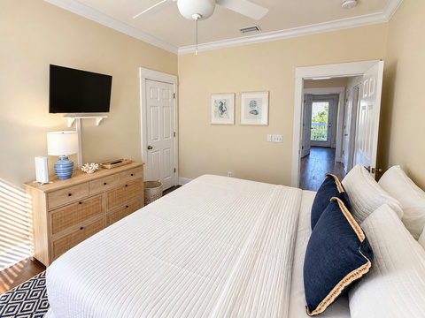 Second king bedroom with dresser and TV