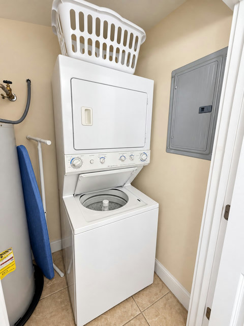 Laundry with stacked washer and dryer