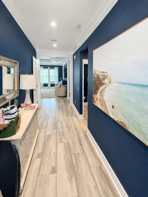 Hallway with coastal artwork
