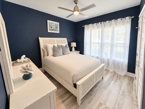 Bedroom 3 with queen bed and coastal decor