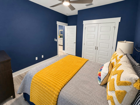 Bedroom 2 closet and queen bed