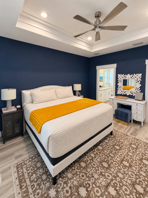 Primary suite with king bed and vanity desk