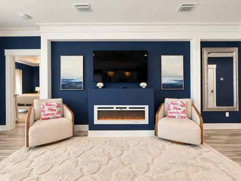 Cozy swivel chairs by the electric fireplace