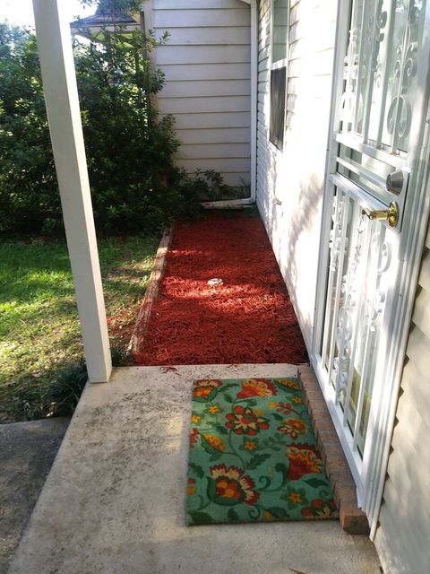 Welcoming entrance with rod iron security door, ring camera, keyless entry and motion sensor lighting