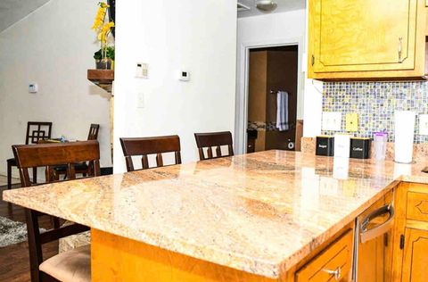 Eat in kitchen with 4 piece updated stainless steel appliances, ice maker, glassware, plates, pots/pans and utensils 