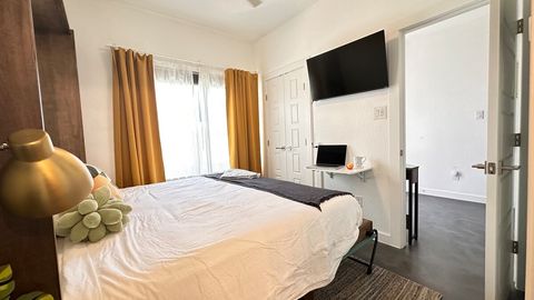 Additional work space even when the bed is open.  Closes flat when not in use. Outlets and charger ports right at desk height for all your devices.  Sit right on the end of the bed and check in with work before settling in for the night. 
