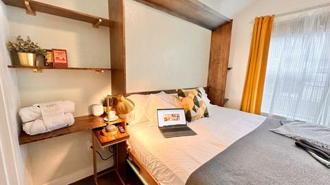 This super comfy king sized murphy bed has underbed lighting with a remote on the wall which adjusts from brighter to dimmer and even has pulsating light options.  At the head of the bed, there is are usb, usb-c and standard plugs for guest devices. 
