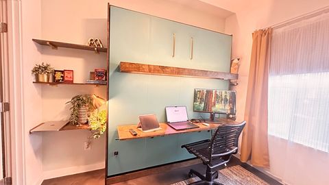 Plenty of well-lit space for working remotely.  The fold-down desk on the closed Murphy bed features ample workspace, desk lighting, multiple outlets and charging ports.