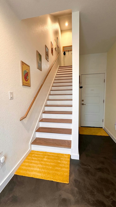 On the left, stairs to the main floor.  On the right, the door to the garage.