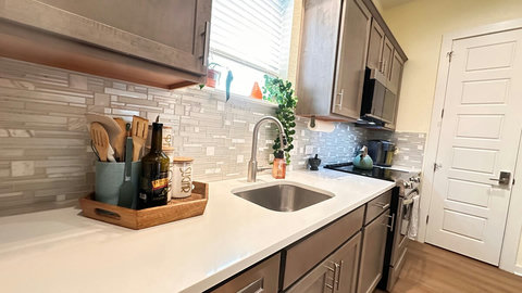 The kitchen is compact, clean, and bright and has all the basics needed for cooking.