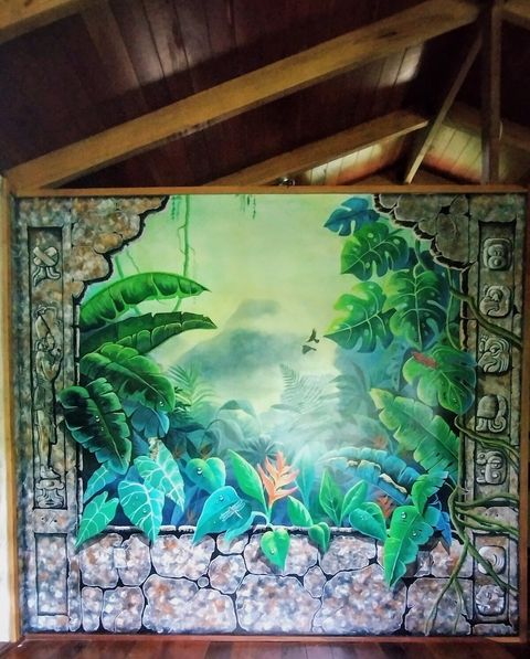 A mesmerizing wall mural added to the Banana Bungalow 8/2023 by local artists.