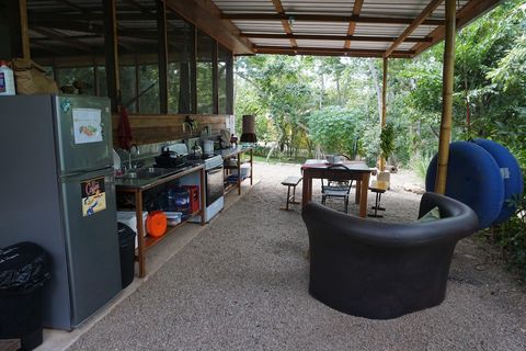Full outdoor kitchen (shared).  Six burner stove, double sink, full size frig/freezer, coffee grinder, tea kettle, French press and much more!