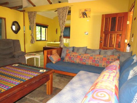Living room with view of bedroom.  Privacy curtains separate bedroom from living room if needed.