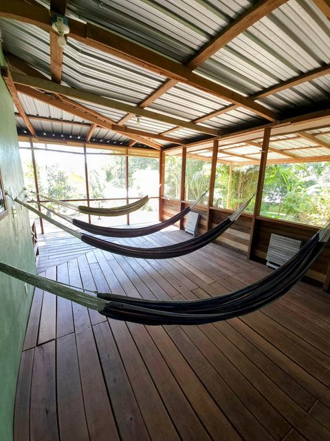 HUGE screened in deck with 4 hammocks, dining table & extra patio seating!
