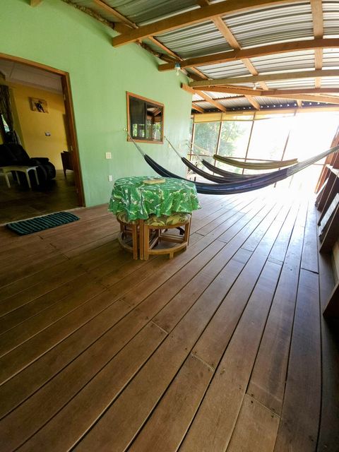 HUGE screened in deck with 4 hammocks, dining table & extra patio seating!