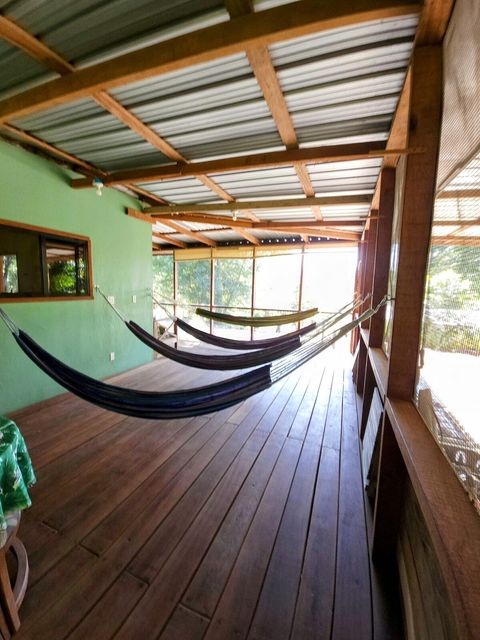 HUGE screened in deck with 4 hammocks, dining table & extra patio seating!