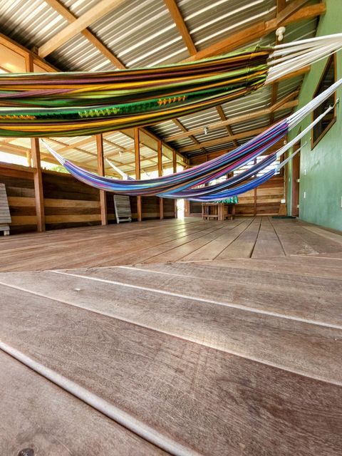 HUGE screened in deck with 4 hammocks, dining table & extra patio seating!