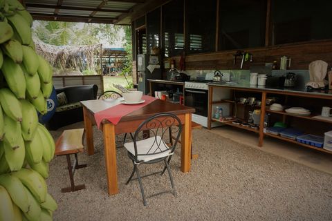 Shared outdoor kitchen - includes 6 burner stovetop, full-size frig/freezer and double sink with plenty of counter space.