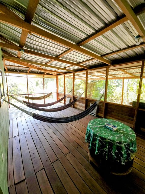 HUGE screened in deck with 4 hammocks, dining table & extra patio seating!