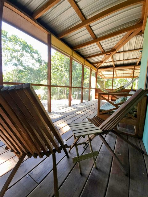 HUGE screened in deck with 4 hammocks, dining table & extra patio seating!