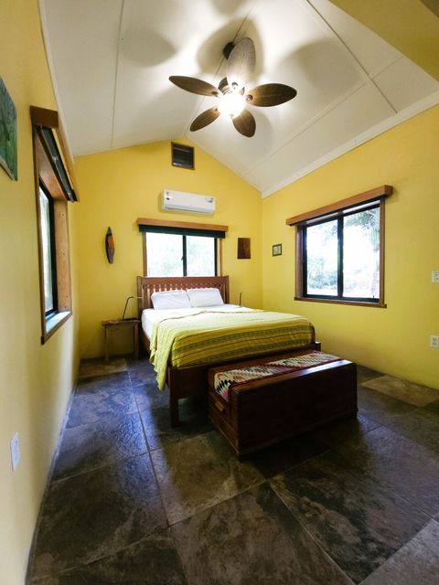 Custom made, Queen bed & 2 night stands. Also 2 LED reading lamps.  Cedar chest at foot of bed holds extra pillows & blankets.