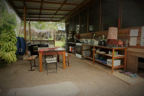 Shared outdoor kitchen - includes 6 burner stovetop, full-size frig/freezer and double sink with plenty of counter space.