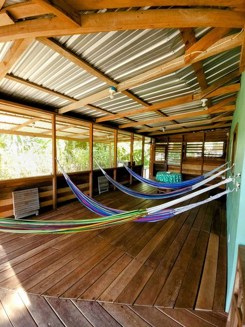HUGE screened in deck with 4 hammocks, dining table & extra patio seating!