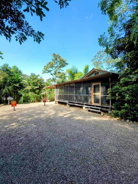 Front view of the Belize Bungalow and designated parking area.