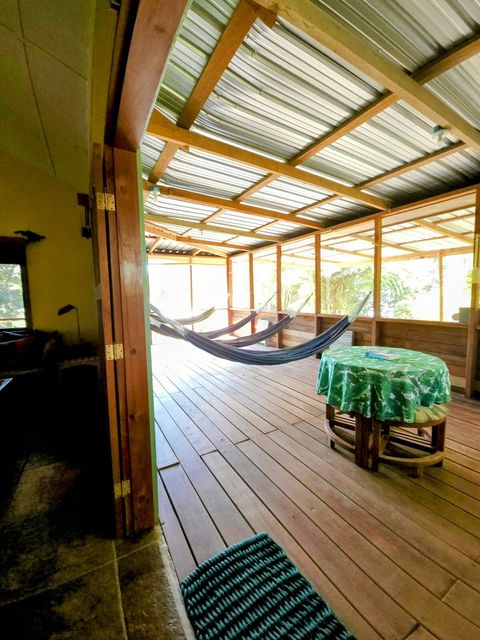 HUGE screened in deck with 4 hammocks, dining table & extra patio seating!