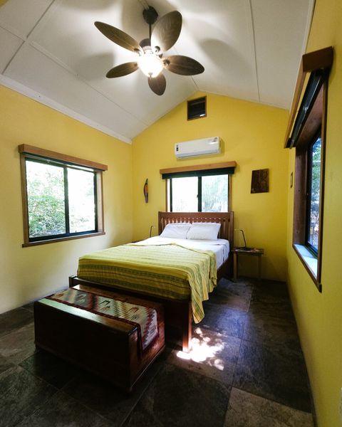 Custom made, Queen bed & 2 night stands. Also 2 LED reading lamps.  Cedar chest at foot of bed holds extra pillows & blankets.