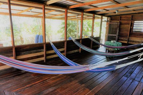 HUGE screened in deck with 4 hammocks & dining area.