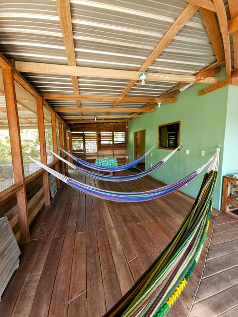 HUGE screened in deck with 4 hammocks, dining table & extra patio seating!