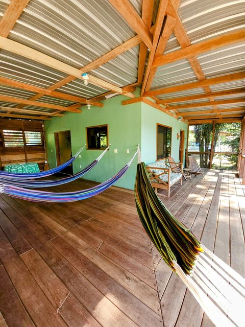 HUGE screened in deck with 4 hammocks, dining table & extra patio seating!