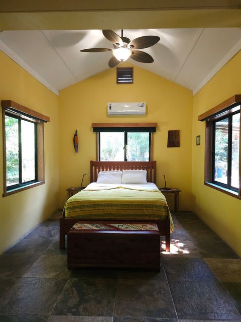Custom made, Queen bed & 2 night stands. Also 2 LED reading lamps.  Cedar chest at foot of bed holds extra pillows & blankets.