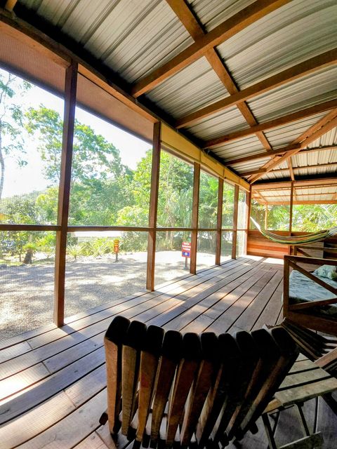 HUGE screened in deck with 4 hammocks, dining table & extra patio seating!