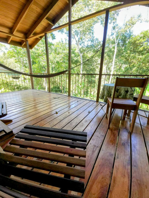 Relax on the deck at the cozy dining table, patio seating, or in the hammock