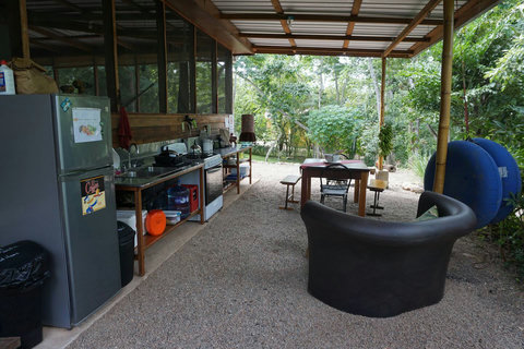 Full outdoor kitchen (shared).  Six burner stove, double sink, full size frig/freezer, coffee grinder, tea kettle, French press and much more!