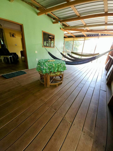 HUGE screened in deck with 4 hammocks, dining table & extra patio seating!