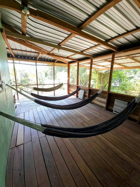 HUGE screened in deck with 4 hammocks, dining table & extra patio seating!