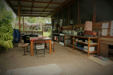 Shared outdoor kitchen - includes 6 burner stovetop, full-size frig/freezer and double sink with plenty of counter space.