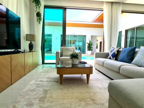 Sitting Area with a Large 75" Smart TV + Sound Bar + Sub Woofer 