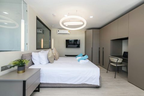 Super comfortable King Bed in Master bedroom 1 with Fenix wardrobe, Smart TV and dedicated working space.