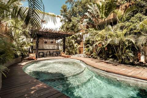 Common pool with bathrooms and bar area available for your use