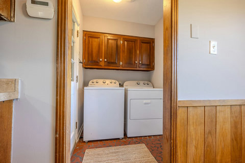 The laundry room features a full-size washer and dryer, two clothes hampers, and is stocked with detergent. Clean and convenient, it’s everything you need to stay fresh and organized during longer stays.