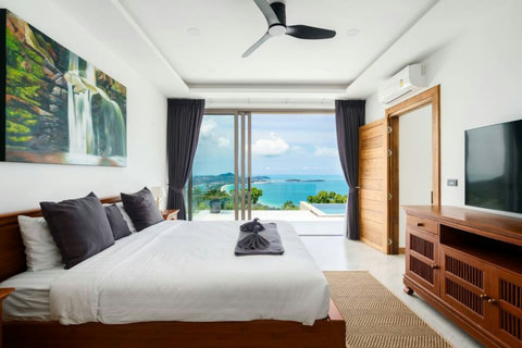 "Sleek Comfort: Our modern bedroom offers AC, a ceiling fan, stylish decor, and an LCD TV for ultimate relaxation."