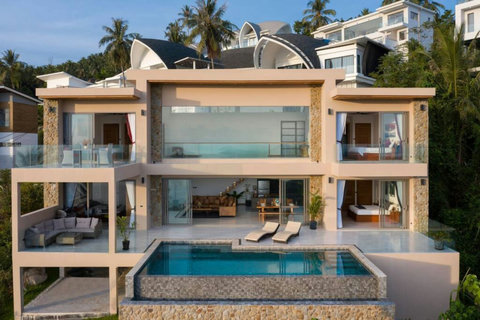 "Aerial Elegance: A drone's eye view showcases the villa's layout, pool, and inviting rooms."